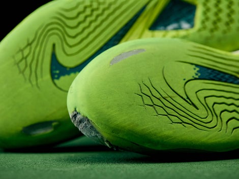 Shoes with outsole worn through to the midsole